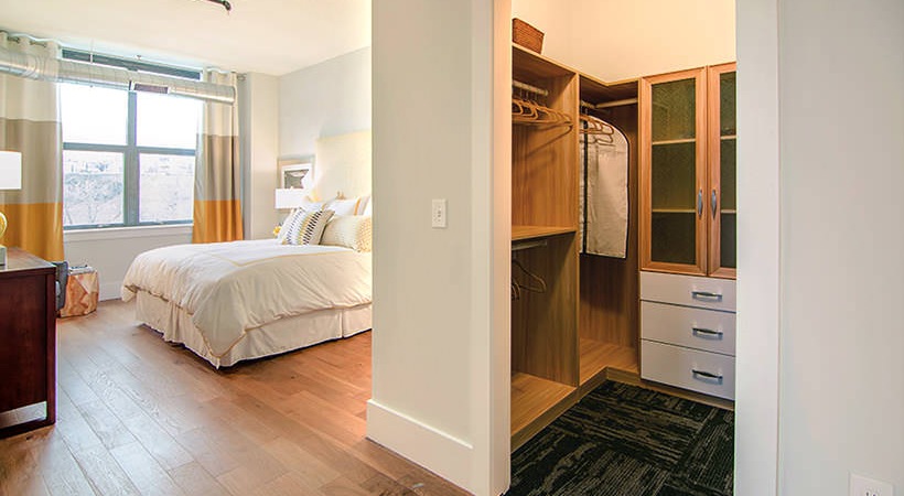 Wood shelving in linen and walk-in closets